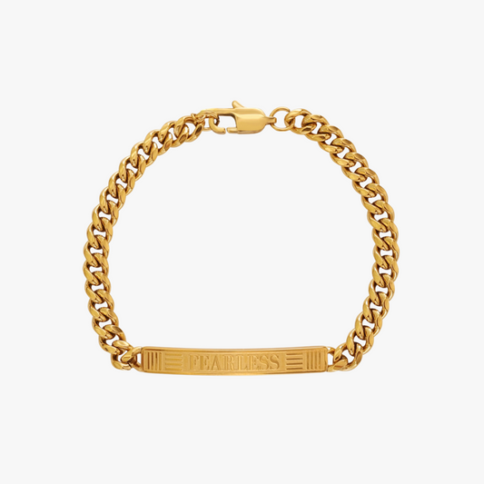 Gold chain bracelet with a rectangular tag on a white background